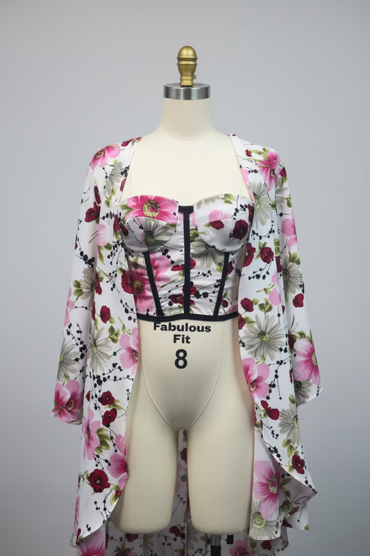 Silky soft kimono robe and corset top set, ideal for loungewear. The robe is beautifully adorned with a vibrant floral pattern, featuring large, colorful blooms that add a touch of elegance.
