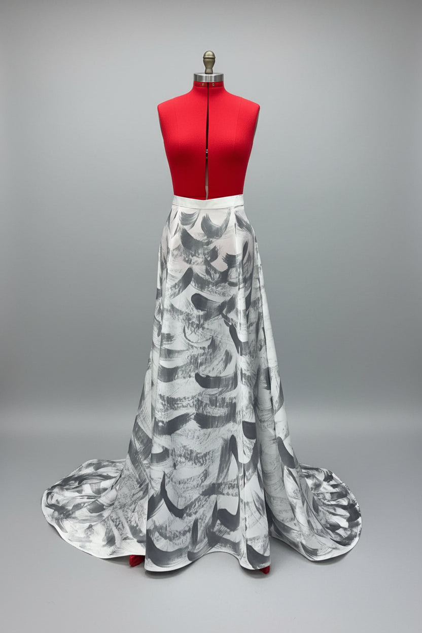 White, crepe back satin floor length skirt with a small train.  Horsehair braid at the hem to give the bottom some structure.