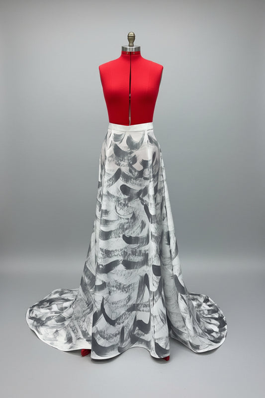 White, crepe back satin floor length skirt with a small train.  Horsehair braid at the hem to give the bottom some structure.